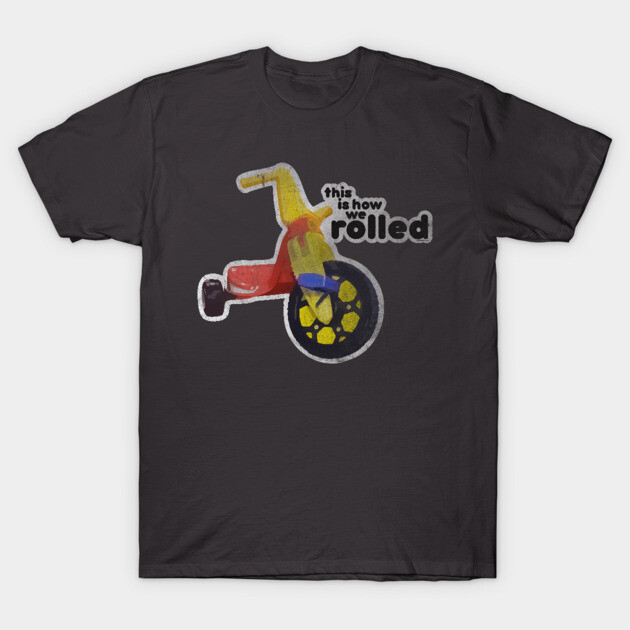 Black T-shirt with vintage tricycle graphic and "this is how we rolled" text, casual cotton apparel for everyday wear.