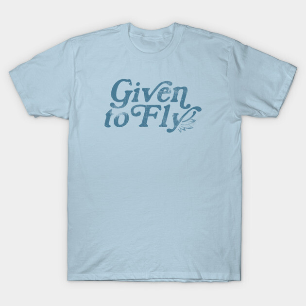 Light blue cotton t-shirt with "Given to Fly" text in artistic font, casual wear.