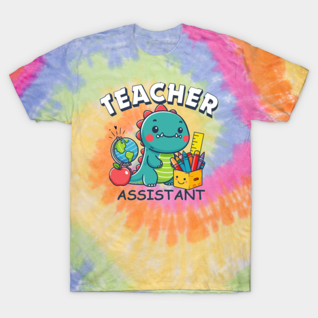 Colorful tie-dye t-shirt featuring "Teacher Assistant" dinosaur design with school supplies; casual cotton apparel.