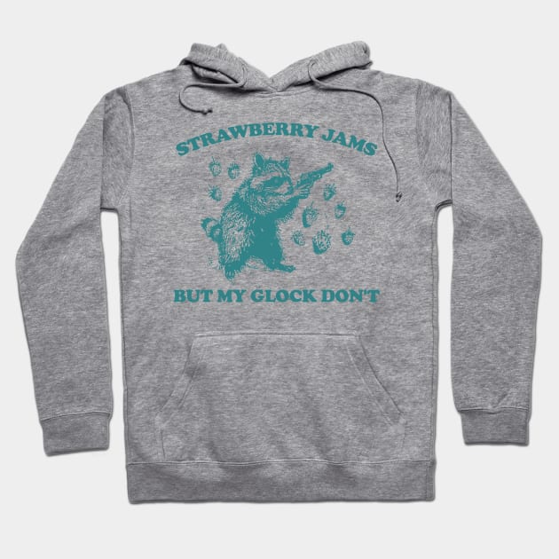 Gray hoodie with playful raccoon and strawberry print, text "Strawberry Jams," casual cotton blend for everyday wear.