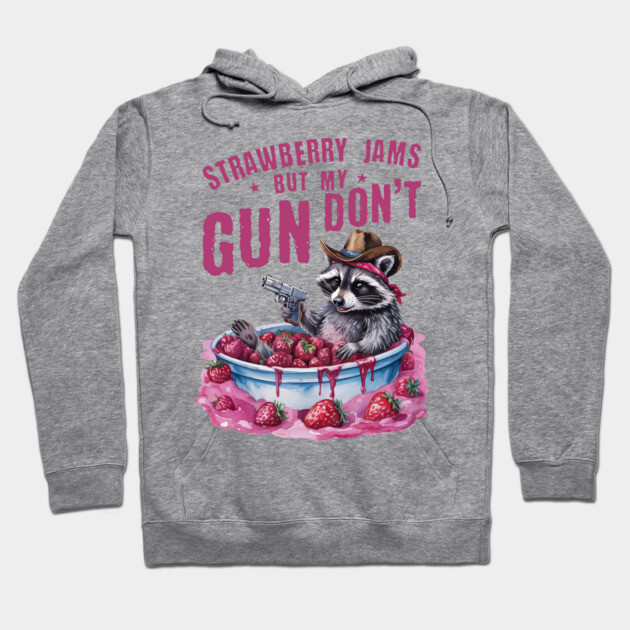 Gray hoodie with playful raccoon and strawberries design, text "Strawberry Jams" in pink. Fun, casual wear.