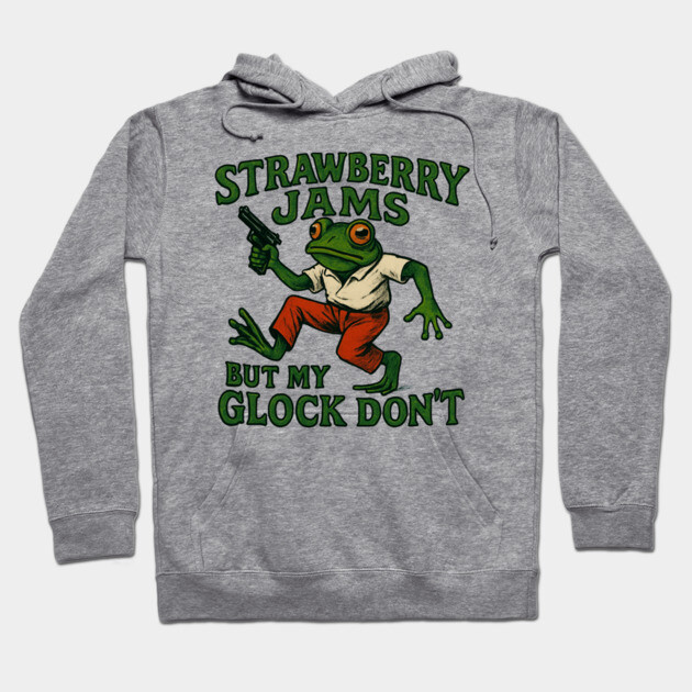 Gray hoodie with green frog graphic and text, "Strawberry Jams But My Glock Don't," casual wear, cotton blend.