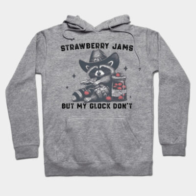 Gray hoodie with raccoon graphic, text "Strawberry Jams But My Glock Don't," casual style, soft cotton blend.