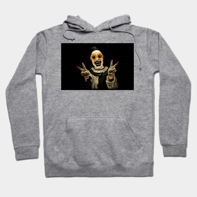 Gray hoodie with creepy clown graphic, unisex style, cozy cotton blend, perfect for casual wear and Halloween events.