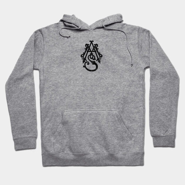 Gray cotton hoodie with black ornate letter design, featuring a front pocket and adjustable drawstring hood, casual wear.