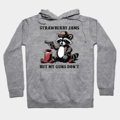 Gray hoodie with raccoon graphic and "Strawberry Jams But My Guns Don't" text, casual style, cotton material.