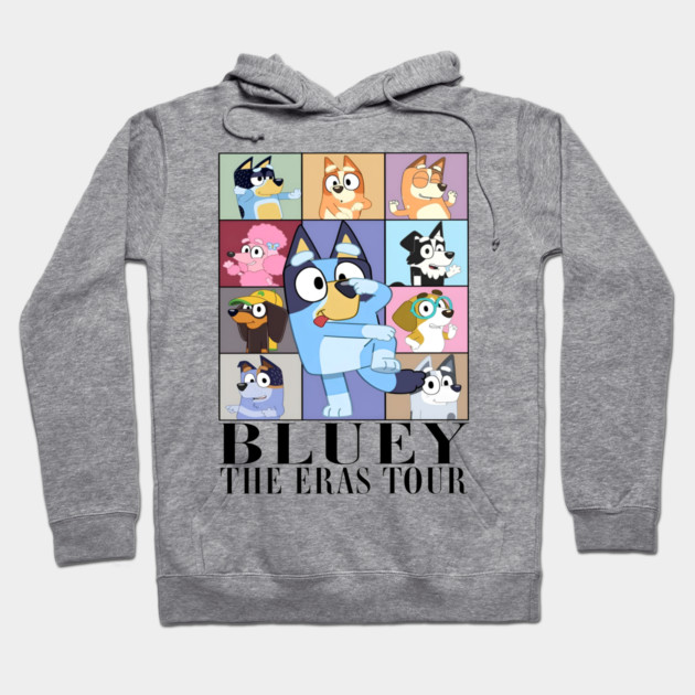 Gray hoodie featuring cartoon character design with colorful squares, "Bluey The Eras Tour" text; casual wear.