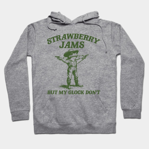 Gray hoodie with green cowboy print and text "Strawberry Jams But My Glock Don't," casual style, cotton blend.