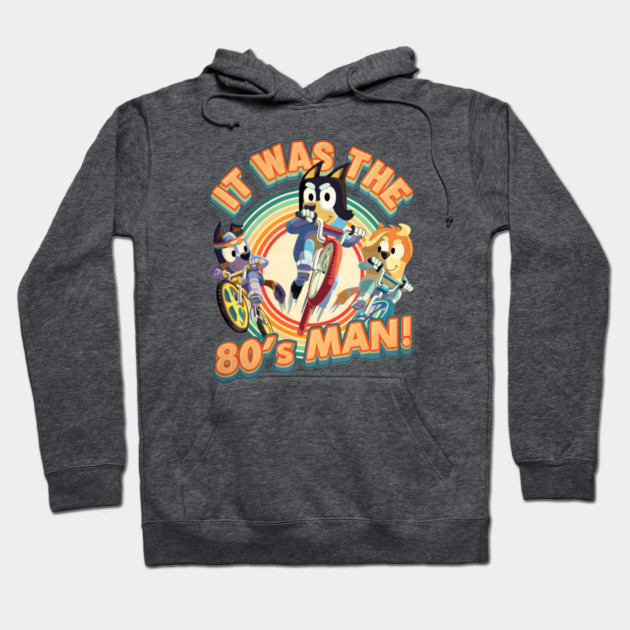 Gray hoodie with colorful retro 80s graphic, featuring cartoon characters on bikes. Comfortable cotton blend material.