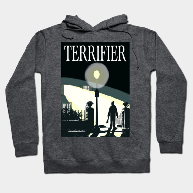 Dark gray hoodie with "Terrifier" design, featuring a silhouette under a streetlamp. Casual wear, cotton blend.