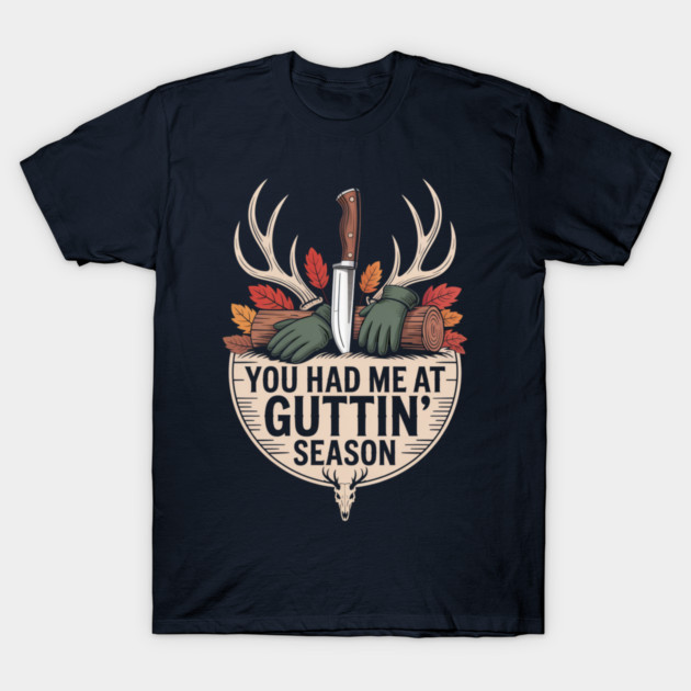 Navy blue t-shirt with hunting-themed graphic, featuring antlers, knife, and autumn leaves. Perfect for outdoor enthusiasts.