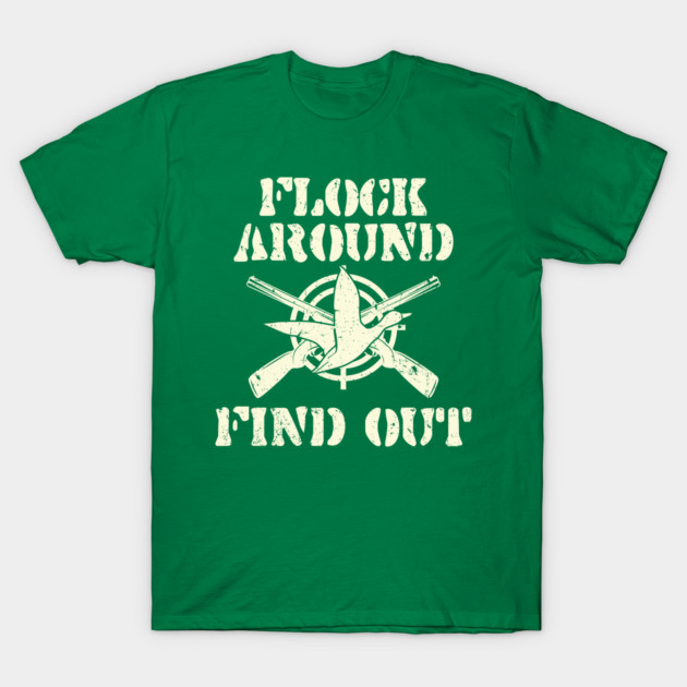 Green graphic T-shirt with bold white text and crossed rifles design, ideal for casual wear and outdoor activities.