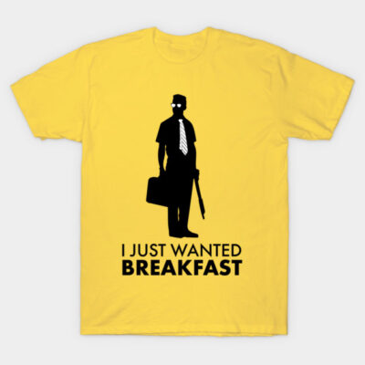 Yellow T-shirt with black silhouette and "I Just Wanted Breakfast" text, casual wear, cotton material.