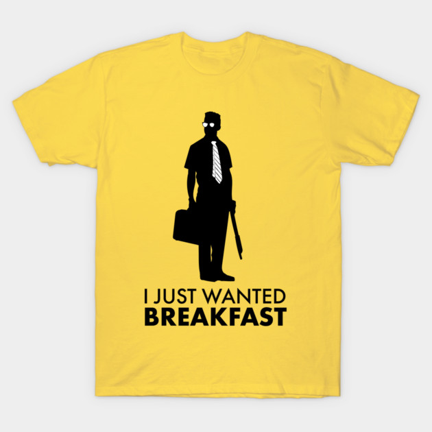 Yellow T-shirt with black silhouette and "I Just Wanted Breakfast" text, casual wear, cotton material.