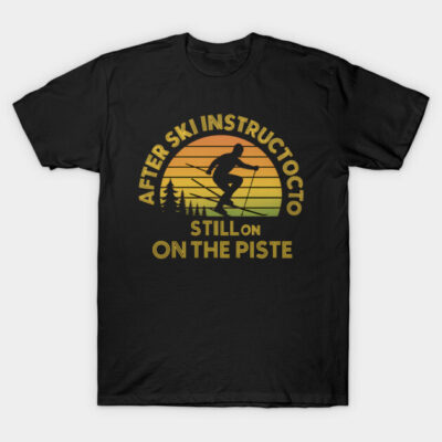 Black ski-themed graphic t-shirt with sunset design, text reads "After Ski Instructor, Still on the Piste," casual wear.