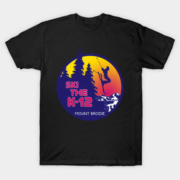 Black t-shirt with colorful "Ski the K-12 Mount Brodie" graphic, featuring skier silhouette and mountain scene.