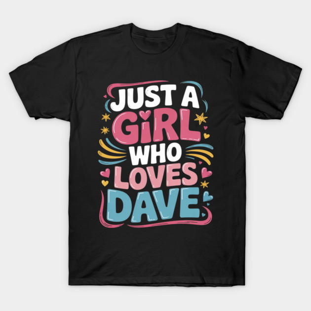 Black t-shirt with colorful text design, "Just a Girl Who Loves Dave," featuring hearts and stars. Casual cotton tee.