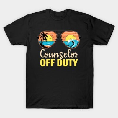 Black t-shirt with "Counselor Off Duty" text and sunglasses graphic featuring beach sunset design. Casual summer wear.