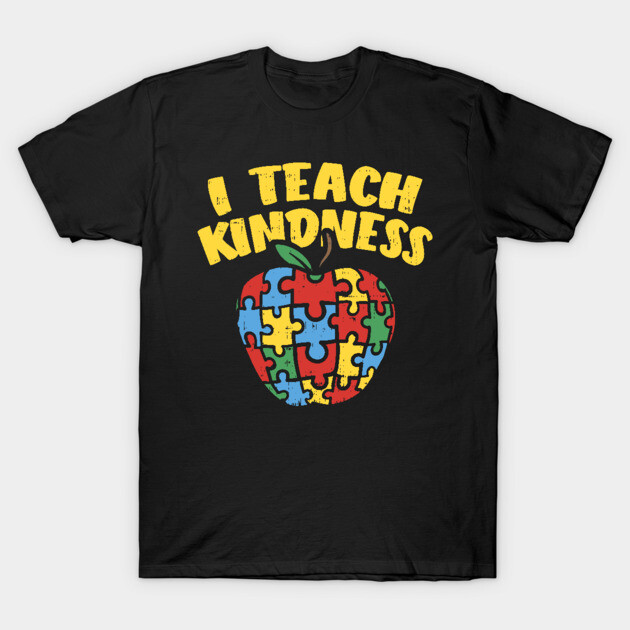Black T-shirt with colorful puzzle apple graphic and "I Teach Kindness" text, ideal for educators, 100% cotton.