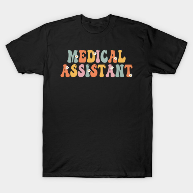"Black t-shirt with colorful 'Medical Assistant' text, casual style, ideal for healthcare professionals, cotton material."