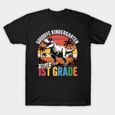 "Black T-shirt with dinosaur graphic and 'Goodbye Kindergarten, Hello 1st Grade' text, colorful and fun design."