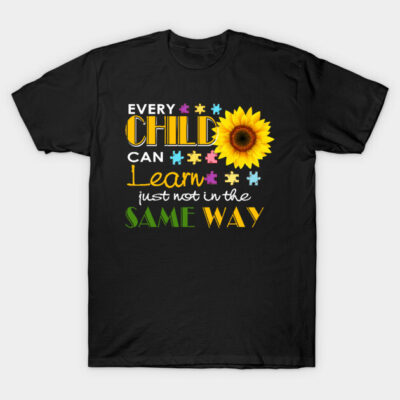 Black t-shirt with "Every Child Can Learn" quote, colorful puzzle pieces, sunflower graphic, educational theme.