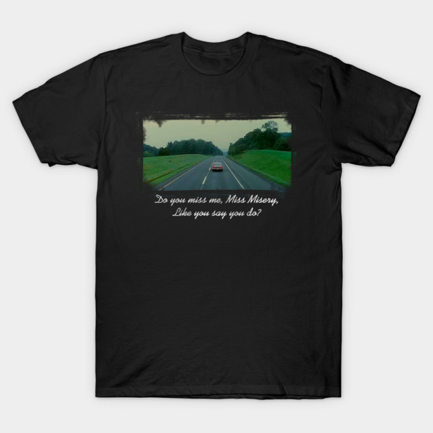 Black cotton t-shirt featuring a scenic road graphic with text, perfect for casual wear and outdoor adventures.