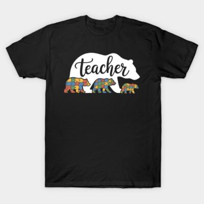 Black t-shirt with "Teacher" bear design featuring colorful puzzle patterns, ideal for educators, casual wear.