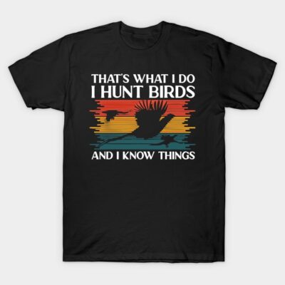 Black T-shirt with colorful sunset bird design and "I Hunt Birds" text, casual style, cotton material.