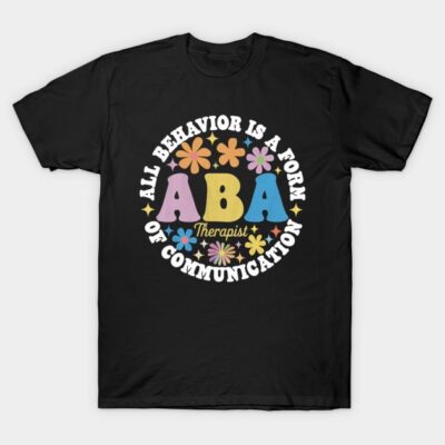 Black ABA therapist T-shirt with colorful text and floral design, ideal for casual wear and promoting communication awareness.