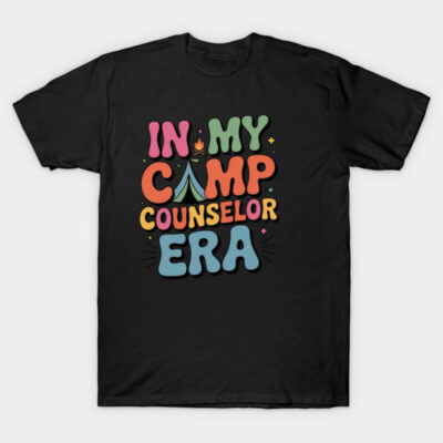 Black T-shirt with colorful text "In My Camp Counselor Era," featuring playful camping design, casual style.