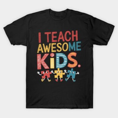 Black t-shirt with colorful "I Teach Awesome Kids" text and puzzle piece design, ideal for teachers. Cotton material.