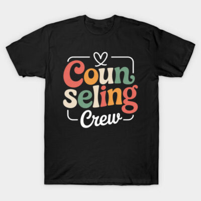 "Black t-shirt with 'Counseling Crew' colorful text design, casual style, perfect for counselors or mental health advocates."