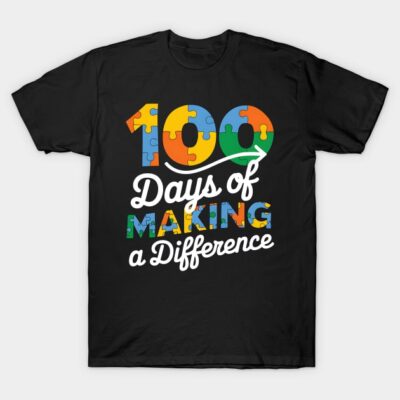"Black t-shirt with colorful puzzle graphic and '100 Days of Making a Difference' text, cotton material, casual wear."