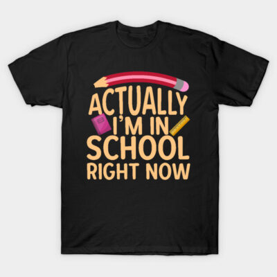 Black t-shirt with "Actually I'm in School Right Now" text, featuring pencil, book, and ruler graphics, casual style.
