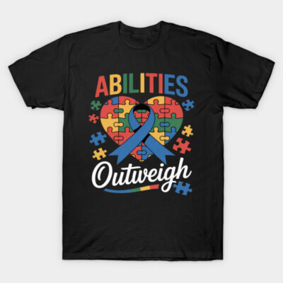 Black t-shirt featuring colorful "Abilities Outweigh" puzzle heart design, promoting autism awareness and inclusivity.