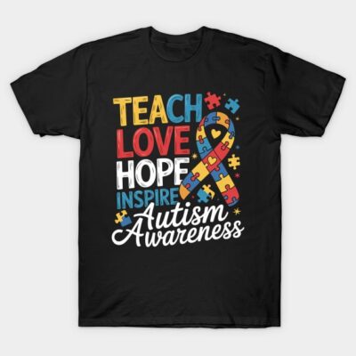 Black t-shirt with colorful "Teach Love Hope Inspire Autism Awareness" design, puzzle piece ribbon graphic.