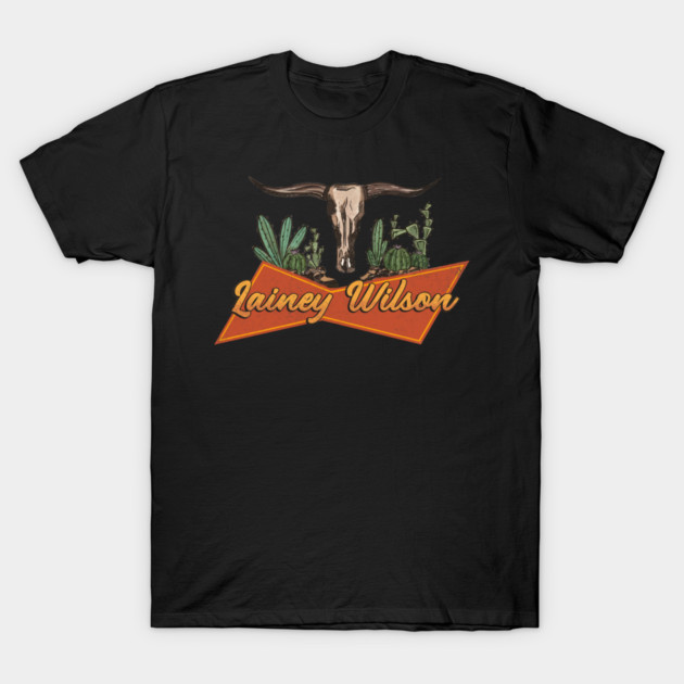 Black t-shirt with western bull skull and cactus design, featuring orange text. Casual wear, cotton material.