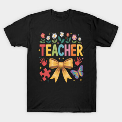 Black t-shirt with colorful "Teacher" design, featuring flowers, bow, puzzle piece, handprints, and butterfly graphics.