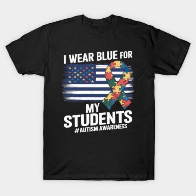 Black autism awareness t-shirt with puzzle ribbon and American flag design, "I Wear Blue for My Students" text.