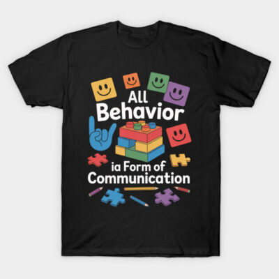 Black t-shirt with colorful puzzle and block graphics, featuring the text "All Behavior is a Form of Communication."
