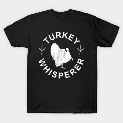 Black "Turkey Whisperer" T-shirt featuring a white turkey graphic, casual style, 100% cotton, perfect for turkey enthusiasts.