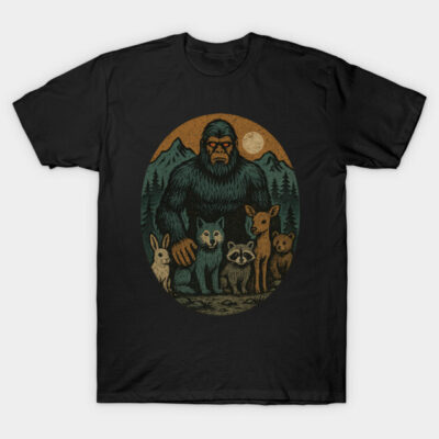Black t-shirt with wilderness design, featuring forest creatures and mountains under a moonlit sky. Casual wear.