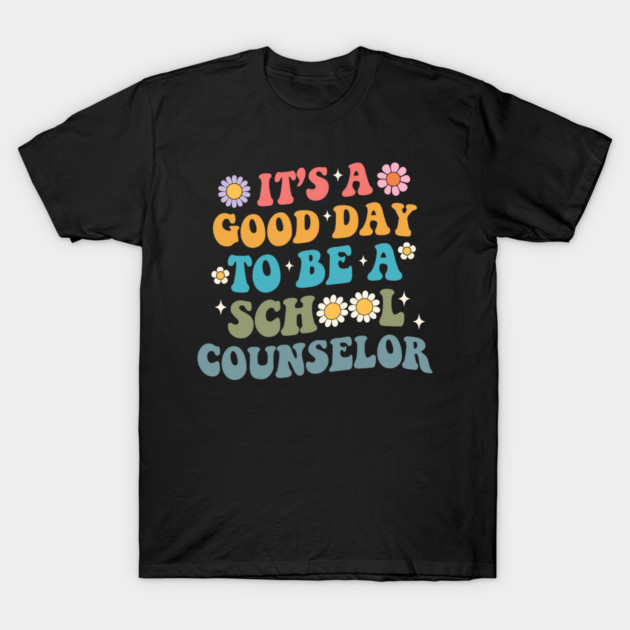 Black t-shirt with colorful "Good Day to Be a School Counselor" print, floral accents, casual style.