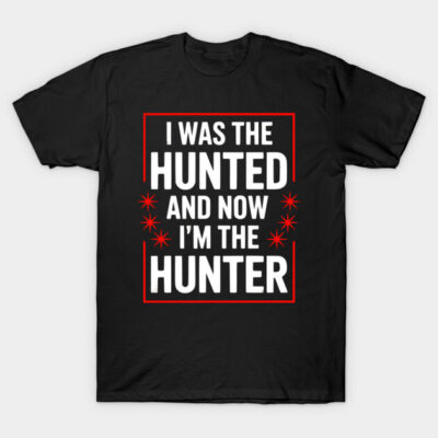 Black cotton t-shirt with bold white and red text "I Was the Hunted and Now I'm the Hunter," casual style.