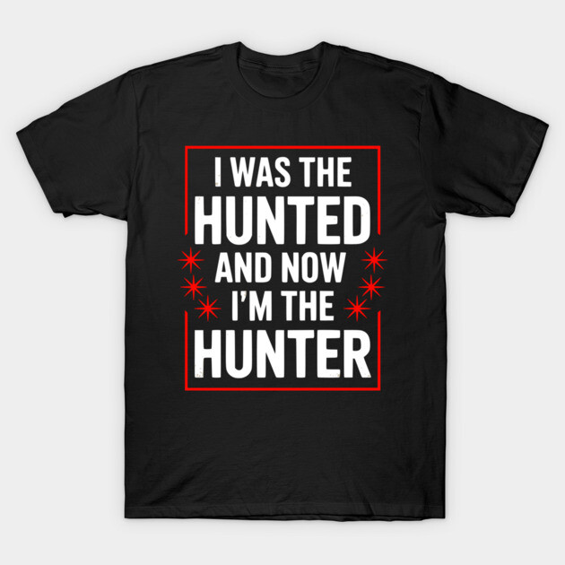 Black cotton t-shirt with bold white and red text "I Was the Hunted and Now I'm the Hunter," casual style.