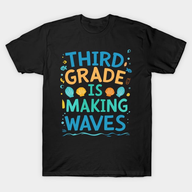 Black t-shirt with colorful "Third Grade is Making Waves" text and seashell design, ideal for school-themed events.