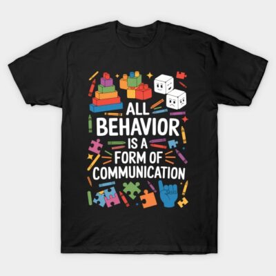 Black T-shirt with colorful educational design and message "All Behavior is a Form of Communication" for awareness.