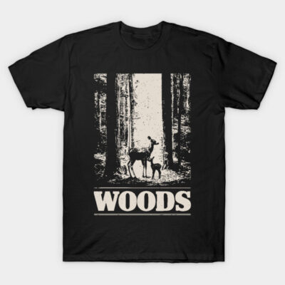 Black t-shirt with "Woods" graphic, featuring deer in forest scene, cotton material, casual outdoor style.