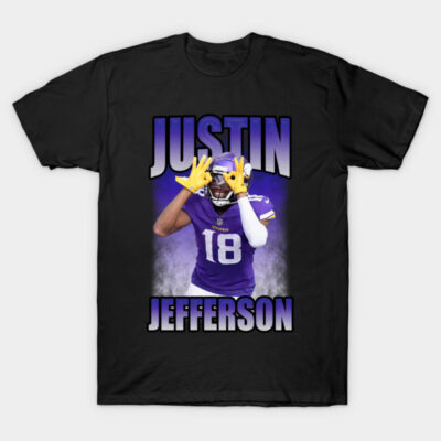 Black T-shirt with football player graphic, purple jersey, yellow gloves, and bold text design. Sports fan apparel.